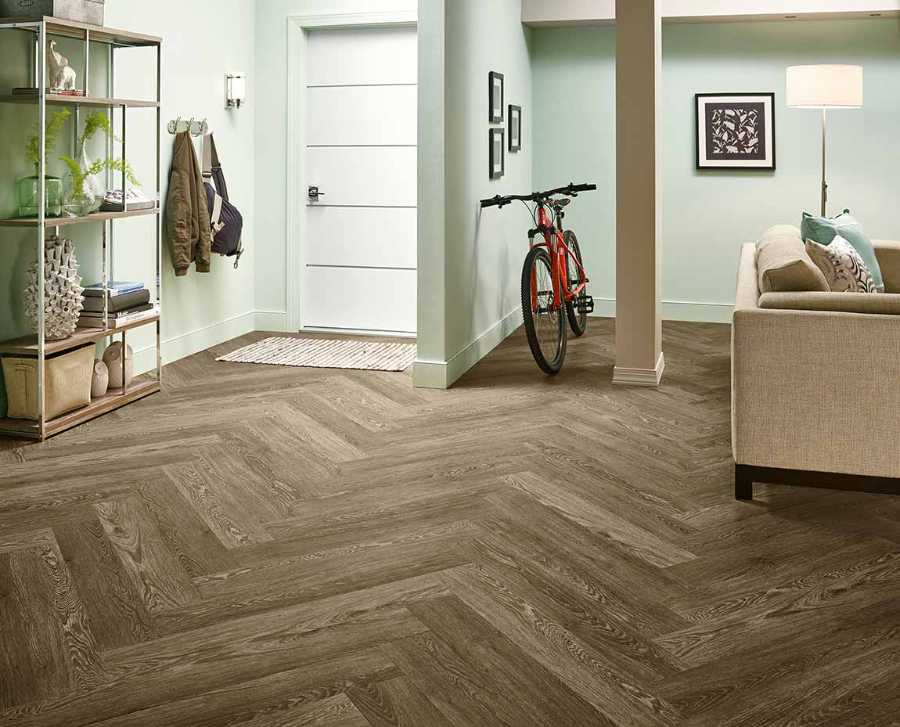 transitional style basement living room with herringbone floor